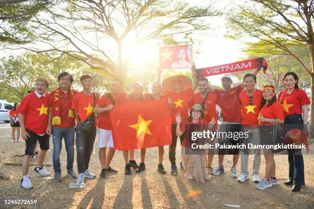 Vietnam fans pose for photos with a portrait of the late Vietnamese President Ho Chi Minh prior to the AFF Mitsubishi Electric Cup final second leg...