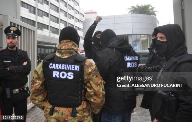 Carabinieri of the ROS stand in front of the Maddalena private clinic in Palermo on January 16, 2023 after the arrest of Italy's top wanted mafia...