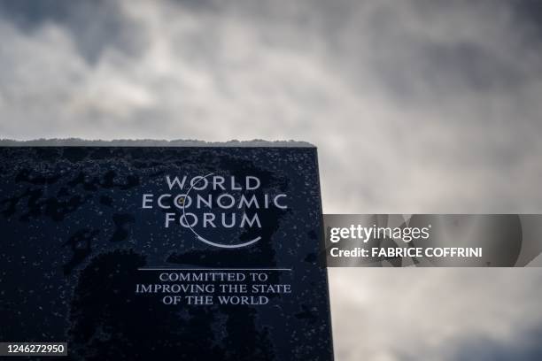 Photograph shows a sign of the World Economic Forum in the alpine resort of Davos, on the opening day of the annual meeting in Davos on January 16,...