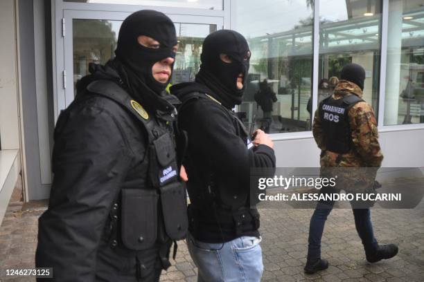 Carabinieri of the ROS stand in front of the Maddalena private clinic in Palermo on January 16, 2023 following the arrest of Italy's top wanted mafia...