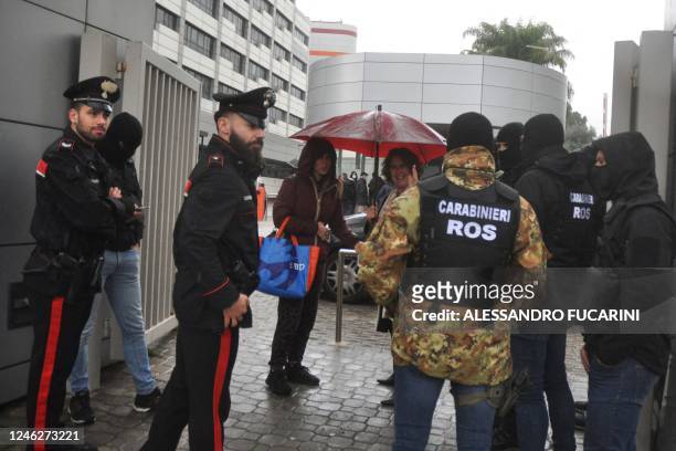 Carabinieri of the ROS stand in front of the Maddalena private clinic in Palermo on January 16, 2023 following the arrest of Italy's top wanted mafia...