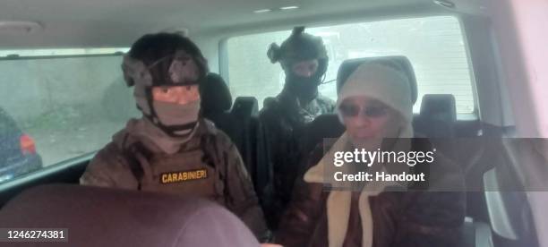 In this handout image provided by the Carabinieri, Matteo Messina Denaro is transported in a van after he was arrested In Sicily, on January 16, 2023...