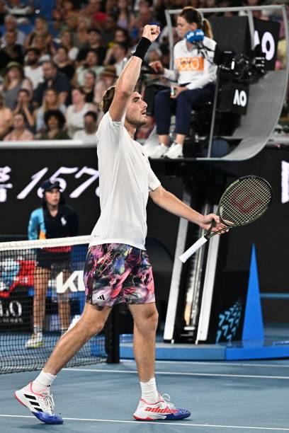 Greece's Stefanos Tsitsipas celebrates a point against France's Quentin Halys during their men's singles match on day one of the Australian Open...