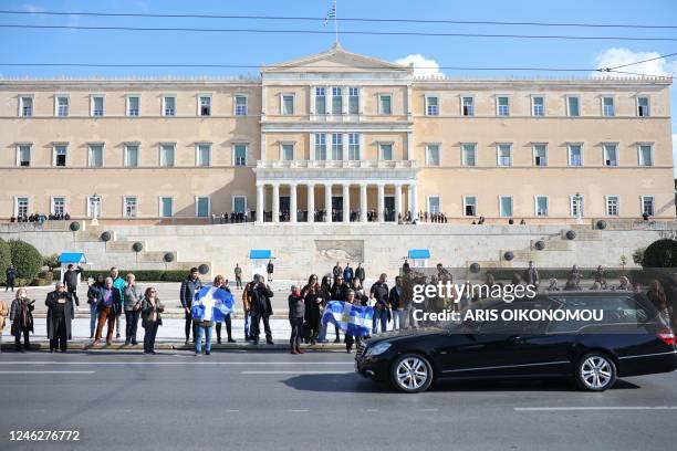 The hearse carrying Constantine II coffin passes in front of the Greek Parliament during the funeral of former King Constantine of Greece in Athens,...