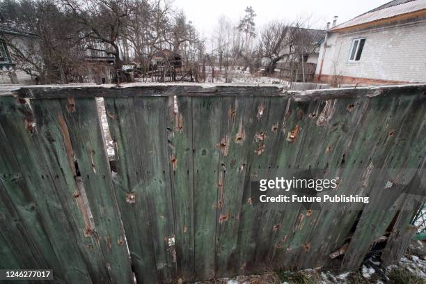 Bullet holes dot a wooden fence, Yahidne village, Chernihiv Region, northern Ukraine. During the Russian occupation of the village, Russian invaders...