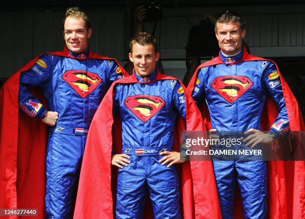 Red Bull drivers Dutch Robert Doornbos, Austrian Christian Klien and Scottish David Coulthard wear Superman costumes in the pits of the Monaco...