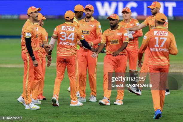 Gulf Giants' players celebrate after the dismissal of Dubai Capitals' Robin Uthappa during the International League T20 tournament cricket match...