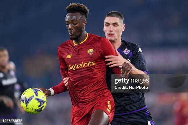 Tammy Abraham of AS Roma and Nikola Milenkovic of ACF Fiorentina compete for the ball during the Serie A match between AS Roma and ACF Fiorentina at...