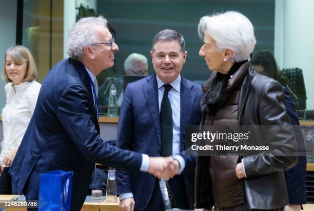 Managing Director of the European Stability Mechanism Pierre Gramegna shakes hands with the President of the European Central Bank Christine Lagarde...