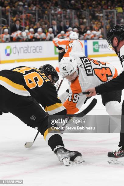 David Krejci of the Boston Bruins faces off against Noah Cates of the Philadelphia Flyers at the TD Garden on January 16, 2023 in Boston,...