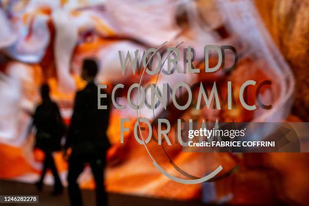 Photograph shows a sign of the World Economic Forum at the Congress centre on the opening day of the World Economic Forum annual meeting in Davos on...