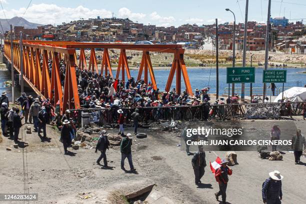 Members of Aymara communities hold a blockade on the Ilave International Bridge to protest against the government of Peruvian President Dina Boluarte...