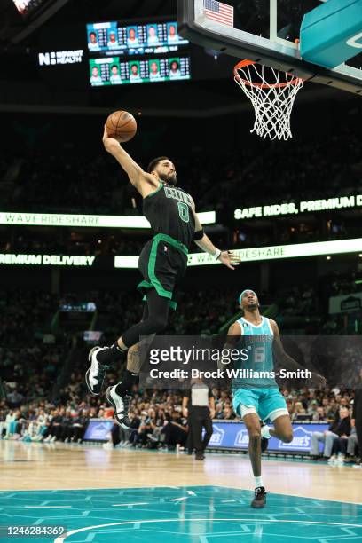 Jayson Tatum of the Boston Celtics dunks the ball during the game against the Charlotte Hornets on January 16, 2023 at Spectrum Center in Charlotte,...