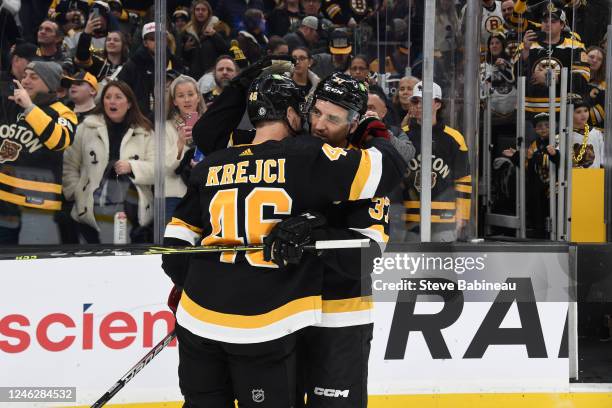 David Krejci and Patrice Bergeron of the Boston Bruins hug after the win against the Philadelphia Flyers at the TD Garden on January 16, 2023 in...