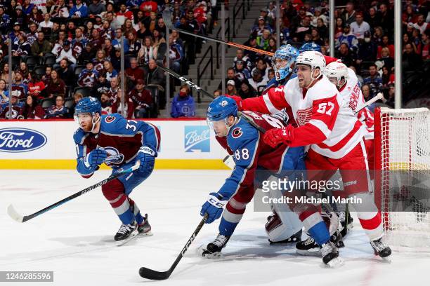 Compher, Andreas Englund and Goaltender Pavel Francouz of the Colorado Avalanche defend against David Perron and Michael Rasmussen of the Detroit Red...