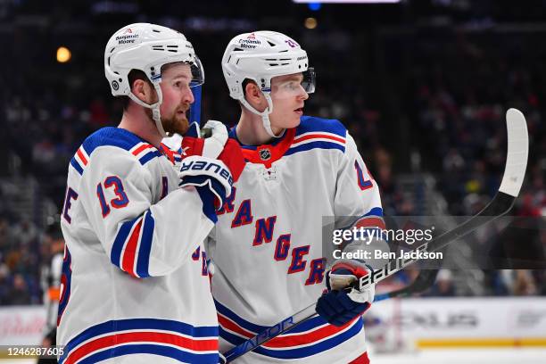 Teammates Alexis Lafrenière and Kaapo Kakko of the New York Rangers talk during the second period of a game against the Columbus Blue Jackets at...