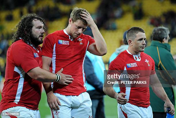 Wales prop Adam Jones , fly-half Rhys Priestland and left wing Shane Williams react after the 2011 Rugby World Cup pool D match South Africa vs Wales...