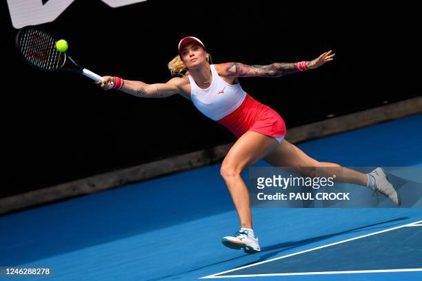 Czech Republic's Tereza Martincova hits a return against Belarus' Aryna Sabalenka during their women's singles match on day two of the Australian...