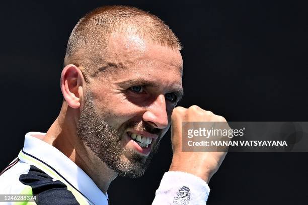 Britain's Daniel Evans reacts on a point against Argentina's Facundo Bagnis during their men's singles match on day two of the Australian Open tennis...