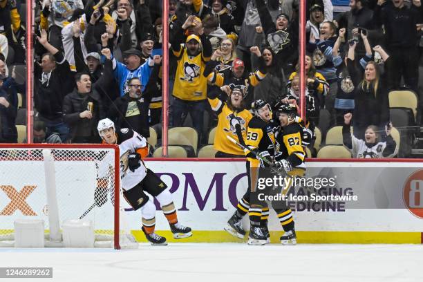 Pittsburgh Penguins Left Wing Jake Guentzel celebrates his game-winning goal with Pittsburgh Penguins Center Sidney Crosby during the overtime period...