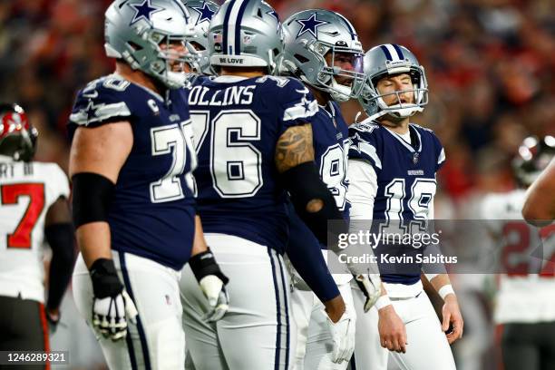 Brett Maher of the Dallas Cowboys reacts after missing an extra-point during the second quarter of an NFL wild card playoff football game against the...