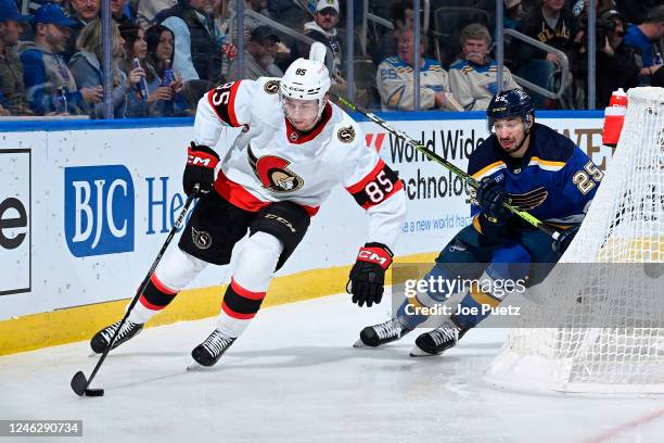 Jordan Kyrou of the St. Louis Blues pressures Jake Sanderson of the Ottawa Senators at the Enterprise Center on January 16, 2023 in St. Louis,...