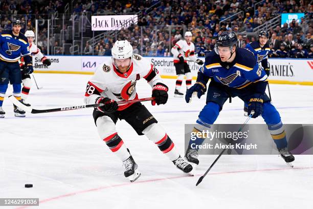 Colton Parayko of the St. Louis Blues defends against Claude Giroux of the Ottawa Senators at the Enterprise Center on January 16, 2023 in St. Louis,...