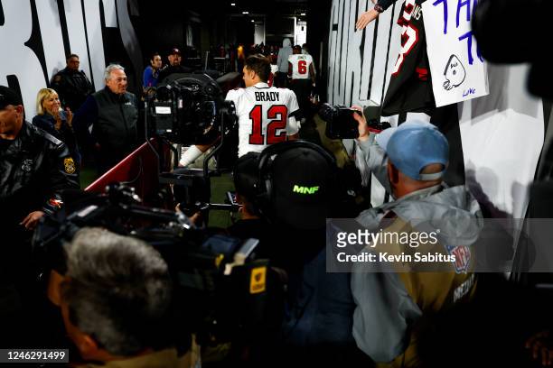 Tom Brady of the Tampa Bay Buccaneers exits the field through the tunnel after an NFL wild card playoff football game against the Dallas Cowboys at...