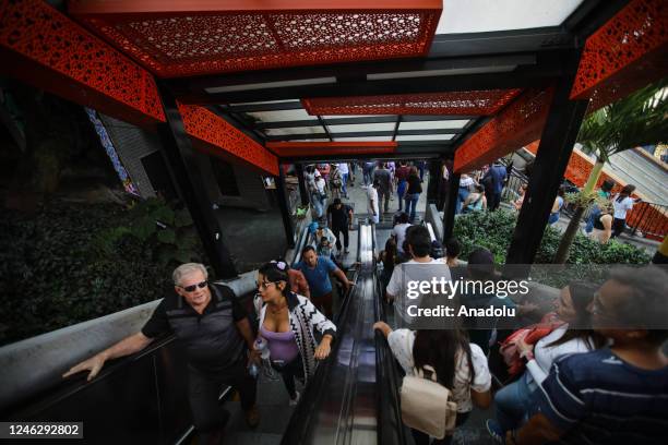 People are seen on the stairs of a subway station in Comuna 13, located on the western side of Medellin, on January 6, 2023 in Colombia. For several...