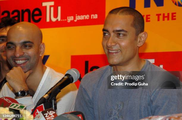 Film director Abbas Tyrewala and Aamir Khan attend the “Jaane Tu... Ya Jaane Na” photocall, where they interacted with patrons and received first...