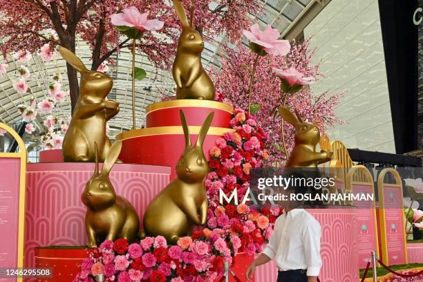 Figurines to mark the upcoming lunar new year of the rabbit are displayed inside the Marina Bay Sands shopping mall in Singapore on January 17, 2023.