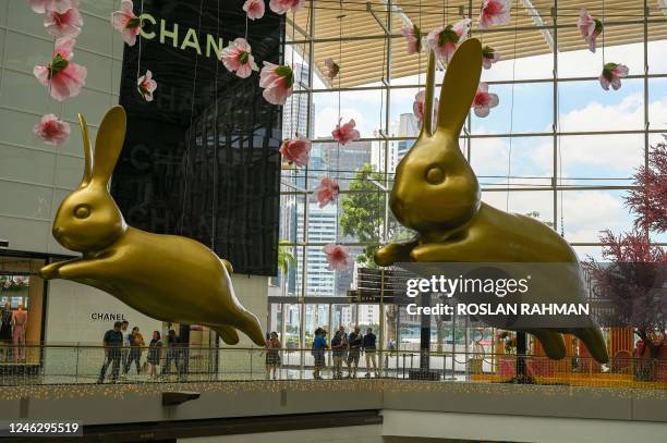 Figurines to mark the upcoming lunar new year of the rabbit are displayed inside the Marina Bay Sands shopping mall in Singapore on January 17, 2023.