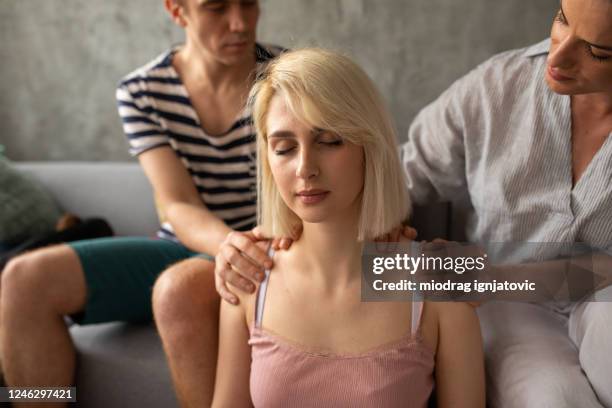 masseuse explaining young man how to give proper massage to his girlfriend at home - girlfriend massage stock pictures, royalty-free photos & images