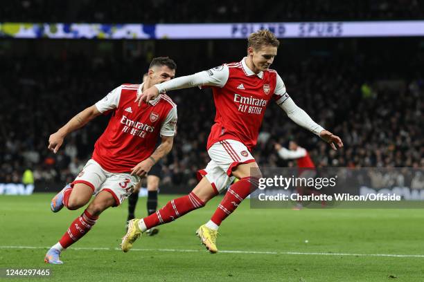 Martin Odegaard of Arsenal celebrates scoring their 2nd goal with Granit Xhaka during the Premier League match between Tottenham Hotspur and Arsenal...
