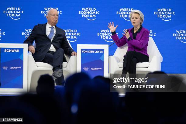 President of the European Commission Ursula von der Leyen speaks as WEF founder Klaus Schwab listens during a session of the World Economic Forum...