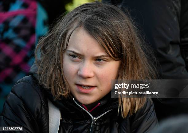 January 2023, North Rhine-Westphalia, Erkelenz: Swedish climate activist Greta Thunberg is among a group of activists and coal opponents sitting on...