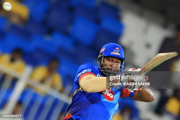 Emirates' Kieron Pollard plays a shot during the International League T20 tournament cricket match between Sharjah Warriors and MI Emirates at the...