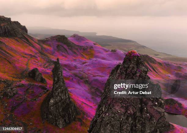 fantasy aerial picture above the dramatic landscape with infrared colors in scotland. - rock background stock pictures, royalty-free photos & images
