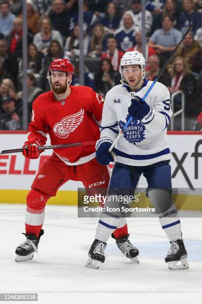 Toronto Maple Leafs forward Michael Bunting gets position in front of the net against Detroit Red Wings defenseman Filip Hronek during an NHL regular...