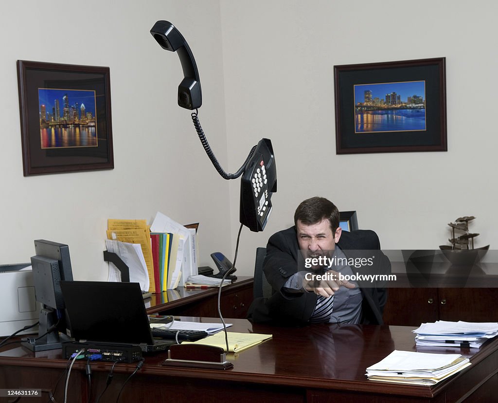 Throw Phone A Man Throwing A Phone In A Fit On His Office High-Res Stock Photo ...