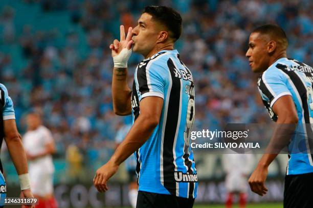 Gremio's Uruguayan forward Luis Suarez celebrates after scoring against Sao Luiz during the Brazilian Recopa Gaucha football match between Gremio and...