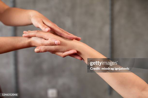 hand massage at spa center - hand massage stock pictures, royalty-free photos & images