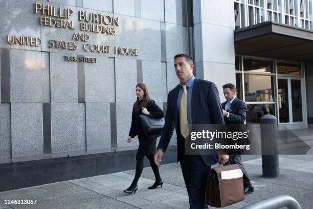 Alex Spiro, attorney to Elon Musk, center, departs court in San Francisco, California, US, on Tuesday, Jan. 17, 2023. Investors suing Tesla and Musk,...