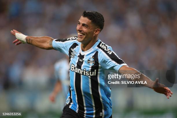 Gremio's Uruguayan forward Luis Suarez celebrates after scoring against Sao Luiz during the Brazilian Recopa Gaucha football match between Gremio and...