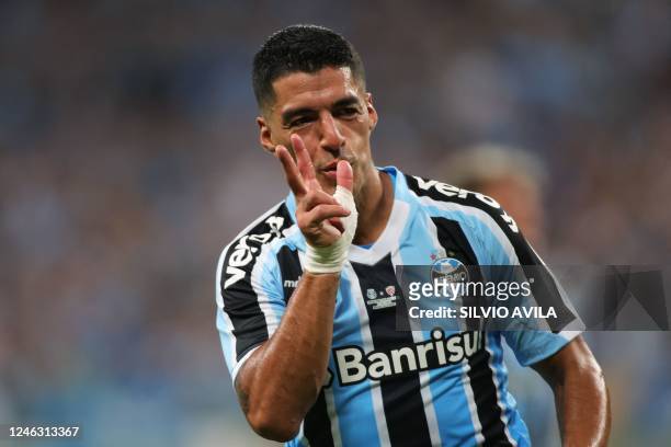 Gremio's Uruguayan forward Luis Suarez celebrates after scoring against Sao Luiz during the Brazilian Recopa Gaucha football match between Gremio and...