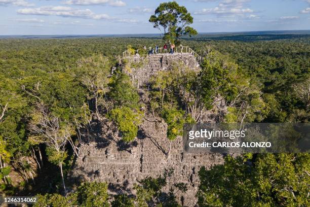 Areal view of La Danta pyramid at the El Mirador archaeological site in San Andres, Guatemala, on January 17, 2023. - Among the vast green mantle of...