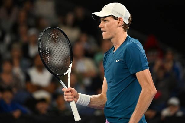 Italy's Jannik Sinner celebrates his victory against Argentina's Tomas Etcheverry during their men's singles match on day three of the Australian...