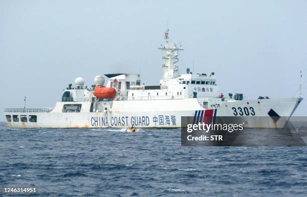 In this photo taken on December 25 a Chinese coast guard ship patrols Scarborough Shoal in the South China Sea.