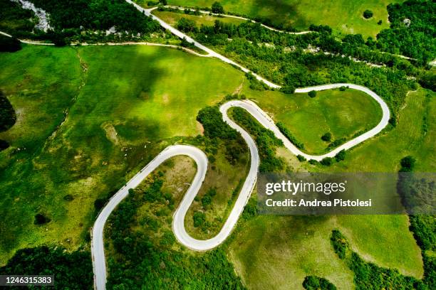 winding road in molise countryside, italy - molise stock pictures, royalty-free photos & images