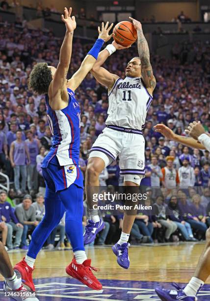 Keyontae Johnson of the Kansas State Wildcats puts up a shot against Jalen Wilson of the Kansas Jayhawks in the second half at Bramlage Coliseum on...